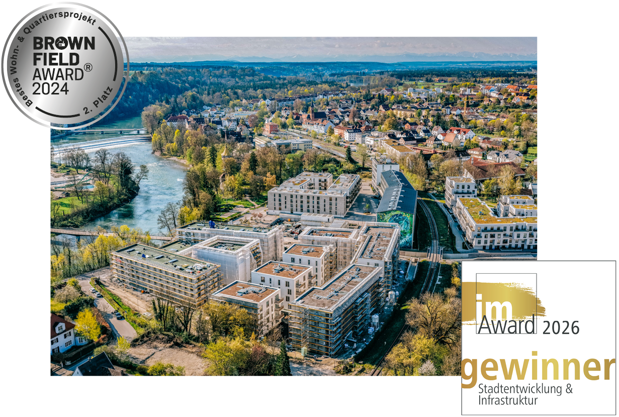 drohnenfoto vom quartier am papierbach mit dem logo des brownfield awards sowie dem m award