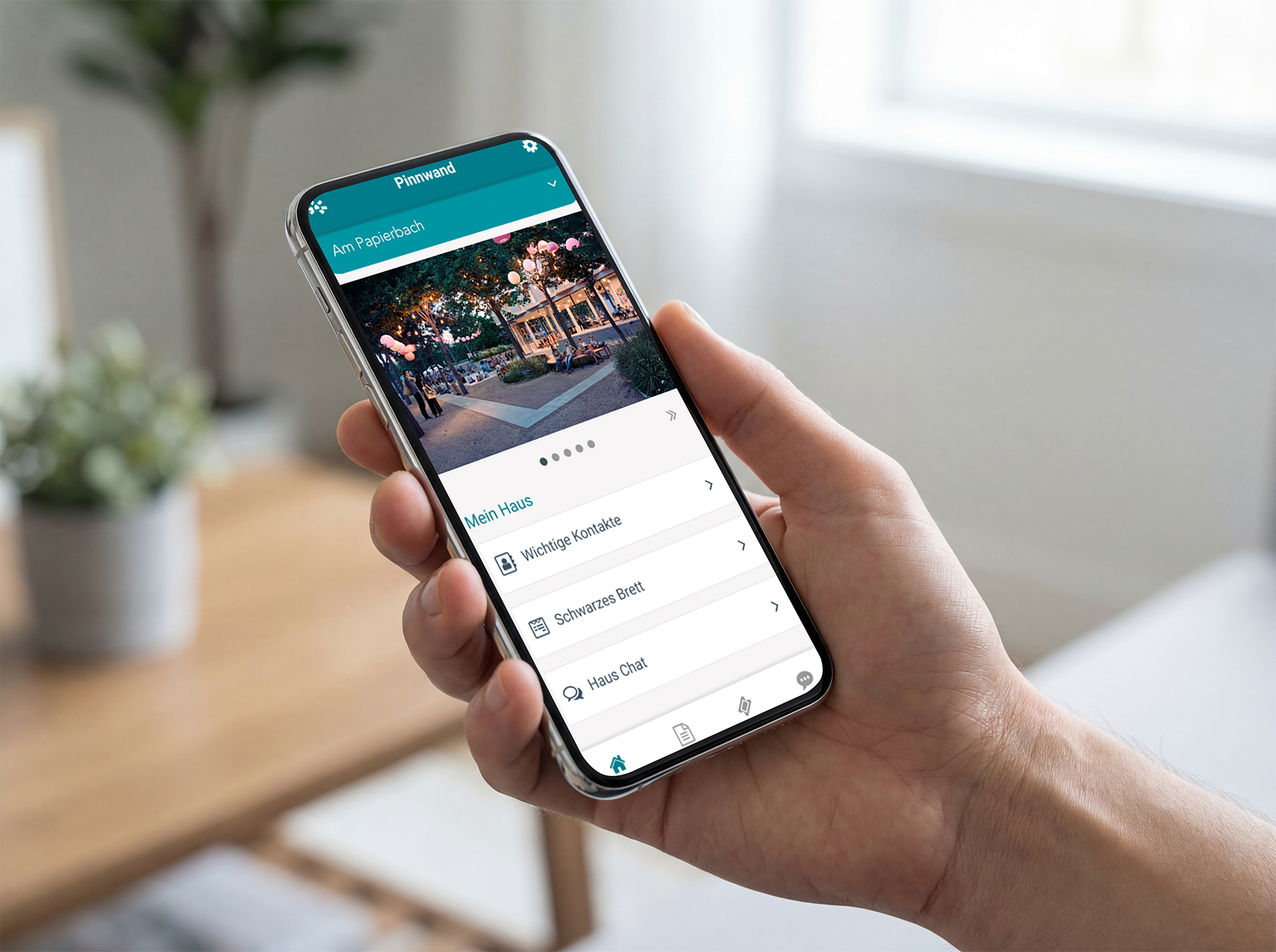 Foto einer Handy mit Smartphone mit geöffneter Quartiersapp